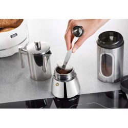 Measuring cup with tamper...